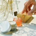 hand with cosmetic ingredients in a lab