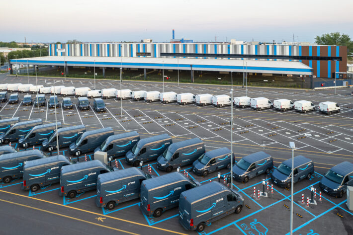 Top view of Amazon Prime electric delivery vans, parked at ..the logistics hub of Amazon